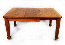 EARLY TWENTIETH CENTURY ARTS AND CRAFTS LIGHT OAK WIND-OUT EXTENDING DINING TABLE WITH ADDITIONAL