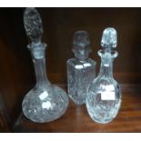 TWO CUT GLASS WINE DECANTERS AND A CUT GLASS SQUARE SPIRIT DECANTER (3)