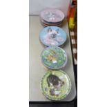 A SET OF TWELVE AYNSLEY CHINA COLLECTOR’S PLATES DECORATED WITH A NAMED CAT FOR EACH MONTH OF THE