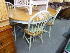 A CIRCULAR KITCHEN DINING TABLE, WITH LIGHT OAK TOP EXTENDING WITH ONE LOOSE LEAF, ON WHITE