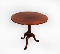 ANTIQUE MAHOGANY TRIPOD BREAKFAST TABLE, the circular tilt top raised on a gun barrel column and