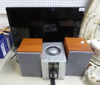 A PURE DMX-25 DAB RADIO/CD PLAYER WITH A PAIR OF SPEAKERS AND A POLAROID 23.6" LED TV/DVD PLAYER