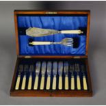 CASED SET OF SIX PAIRS OF FISH EATERS AND SERVERS, with bone hands and engraved blades, in a blue