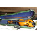 ANDREAS TELLER STUDENT'S VIOLIN, COMPLETE WITH BOW, CHIN REST, AND PRESENTED IN GREEN FAUX-LEATHER