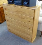 A PINE CHEST OF FIVE LONG DRAWERS, TWO PINE BEDSIDE CABINETS AND AN WHITE OPEN BOOKCASE (4)