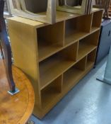A WOOD EIGHT SECTION, THREE TIER OPEN BOOKCASE