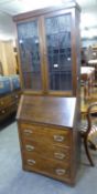 SINGLE SECTION GEORGE V ELEVATED BUREAU BOOKCASE WITH LEADED LIGHTS