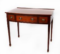 NINETEENTH CENTURY LINE INLAID MAHOGANY BOW FRONTED DRESSING OR WRITING TABLE, the shaped top with