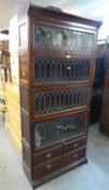 AN EDWARDIAN MAHOGANY GLOBE WERNICKE TYPE SECTIONAL BOOKCASE, WITH FOUR UP AND OVER LEADED GLAZED