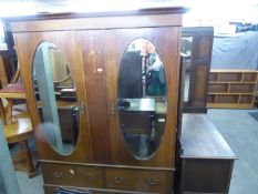 AN EDWARDIAN MAHOGANY LARGE TWO MIRROR DOOR WARDROBE, A MATCHING LARGE DRESSING TABLE WITH OVAL