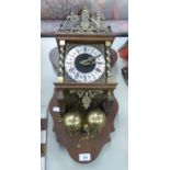 DUTCH WALL CLOCK WITH MECHANICAL MOVEMENT DRIVEN BY TWO HEAVY BRASS PEAR SHAPED WEIGHTS