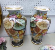 A PAIR OF CONTINENTAL PORCELAIN LARGE OVULAR VASES, PAINTED WITH LEAVES, 16 ½” HIGH