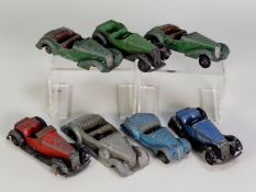 SEVEN DINKY TOYS - CIRCA 1940s DIE CAST SPORTS CARS, all in playworn and incomplete condition, all