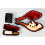 CASED CARVED MEERSCHAUM PIPE, ALSO A CASED SILVER MOUNTED MEERSCHAUM AND AMBER CHEROOT HOLDER,