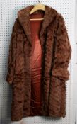 LADY'S BROWN MUSQUASH FULL-LENGTH FUR COAT with shawl collar and cuffs, double breasted hook