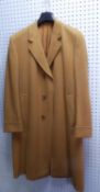 TAILORED FOR KENDAL MILNE BY CHESTER BARRIE, A GENTLEMAN'S CAMELHAIR OVERCOAT, with double