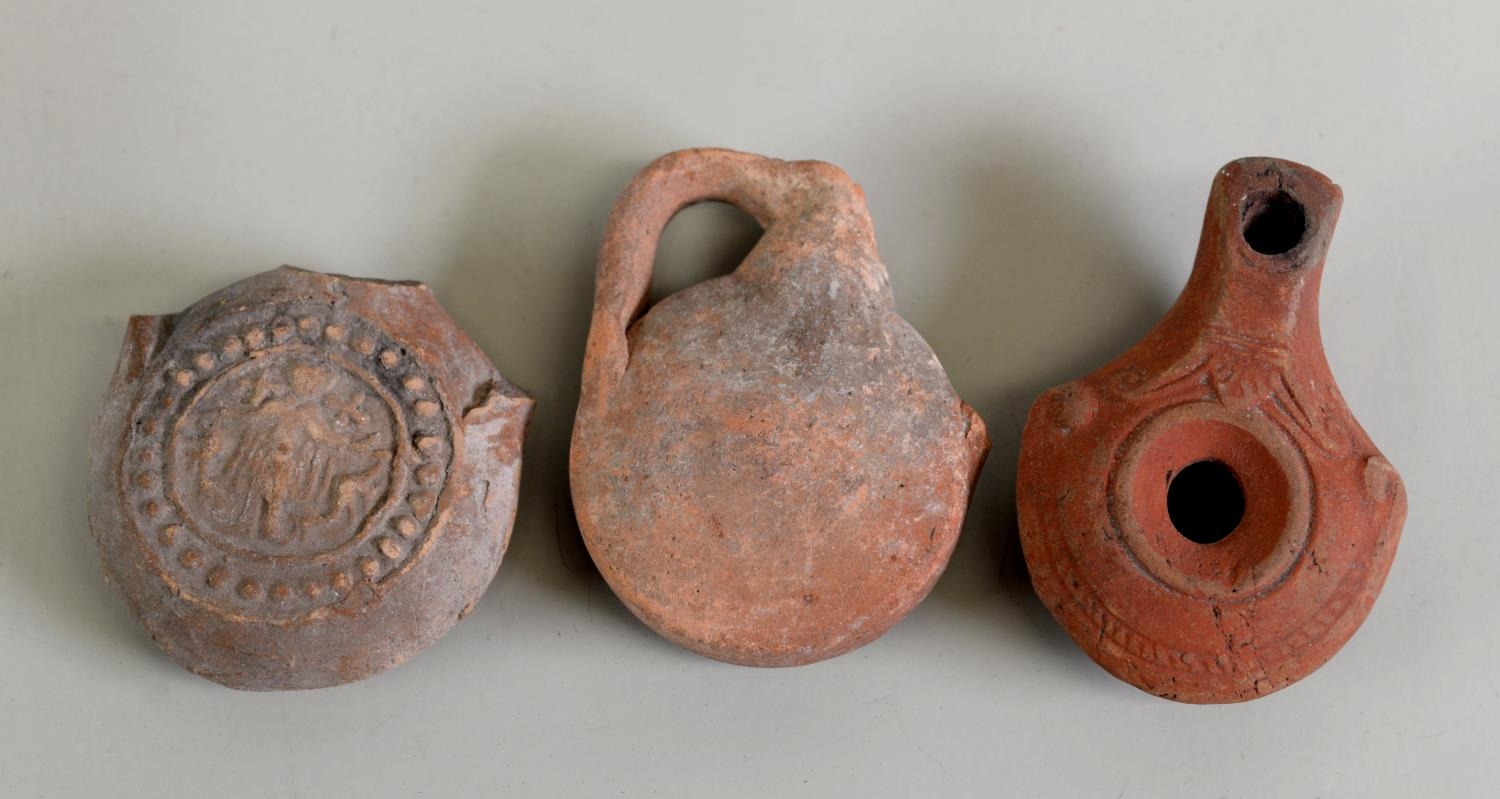 SMALL ROMAN CLAY OIL LAMP, with simple scroll moulded decoration, 3 1/4" (8.3cm) long, DITTO SMALL