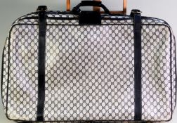 GUCCI VINTAGE MONOGRAM SUITCASE with classic black leather detail on monogrammed canvas, 30in x 20in