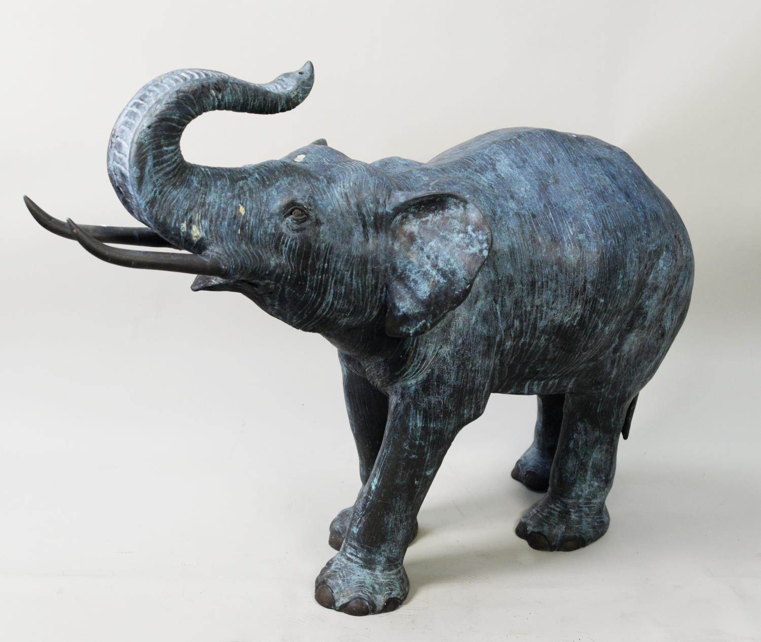 CHINESE BRONZE MODEL OF AN ELEPHANT AS A POND FOUNTAIN, the water flowing in through a back foot and