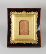 ORNATE EARLY TWENTIETH CENTURY SMALL GILT GESSO PHOTOGRAPH FRAME, with tied ribbon and floral border