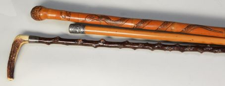 VINTAGE ORIENTAL MALACCA WALKING STICK, WITH EMBOSSED WHITE METAL POMMEL, depicting collage with