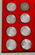 Selection of 9 USA Morgan Dollars, 8 are uncirculated, dated 1880, 81 82 83 84 85 87 88 and 1921