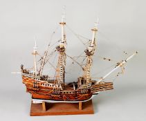 POST-WAR KIT BUILT STAINED AND PAINTED WOOD MODEL OF A THREE-MASTED GALLEON, Santa Maria, two