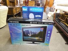 TEVION 42” HD READY FLAT SCREEN TELEVISION, in box,  instructions and remote control, and a