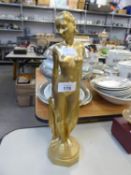 ART DECO GILT PLASTER NUDE FEMALE FIGURE HOLDING DRAPES, ON OCTAGONAL BASE, 13 ½” HIGH