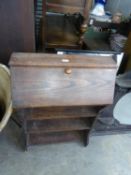 TUB SHAPED WICKER CHAIR ON METAL LEGS,  A SMALL OAK BUREAU, HAVING FALL FRONT AND OPEN SHELVES