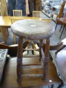 NINETEENTH CENTURY ELM TALL STOOL with circular seat and turned supports, 22 ½” high, and ANOTHER,
