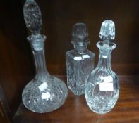 TWO CUT GLASS WINE DECANTERS AND A CUT GLASS SQUARE SPIRIT DECANTER (3)