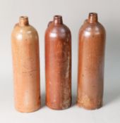 THREE ANTIQUE GERMAN STONEWARE WINE BOTTLES IMPRESSED GEORG KREUZBERG, AHRWEILER, RHEINPREUSSEN, 12"