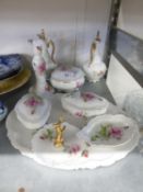 A WHITE CHINA DRESSING TABLE TRINKET SET, PRINTED WITH A PINK ROSE, NINE PIECES INCLUDING THE OVAL