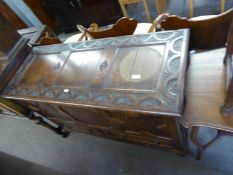 A PRE-WAR JACOBEAN STYLE OAK DOWER CHEST, WITH LIFT-UP TOP, THREE PANEL FRONT WITH TWO SHORT DRAWERS