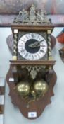 DUTCH WALL CLOCK WITH MECHANICAL MOVEMENT DRIVEN BY TWO HEAVY BRASS PEAR SHAPED WEIGHTS