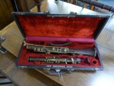 INTER-WAR YEARS UN-NAMED THERMO-PLASTIC AND BRASS OBOE in associated case, incomplete C/R- as found