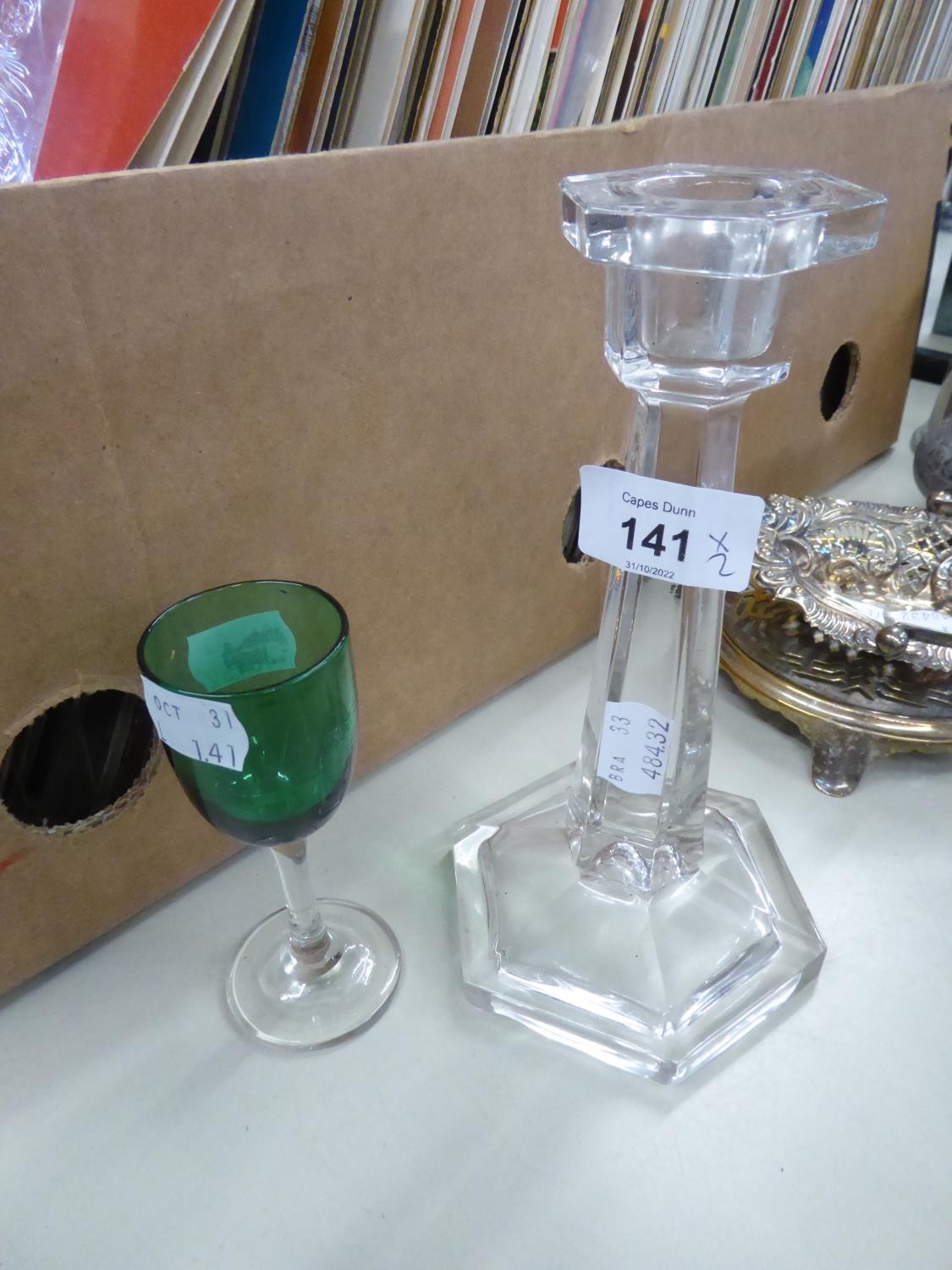 A GLASS CANDLESTICK AND A WINE GLASS WITH GREEN BOWL