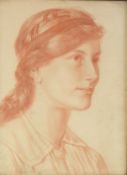 EDWARD RIDLEY (1883 - 1946) RED CHALK DRAWING Portrait of a young woman facing to dexter and wearing