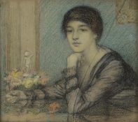 EDWARD RIDLEY (1883 - 1946) PASTEL DRAWING Young woman seated at a table Unsigned 10 1/4in x 11 1/