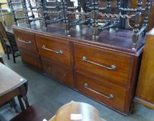 A HUGE MAHOGANY SHOP COUNTER, POSSIBLY FROM A HABERDASHERY SHOP, HAVING SIX LARGE DRAWERS (LACKING 1