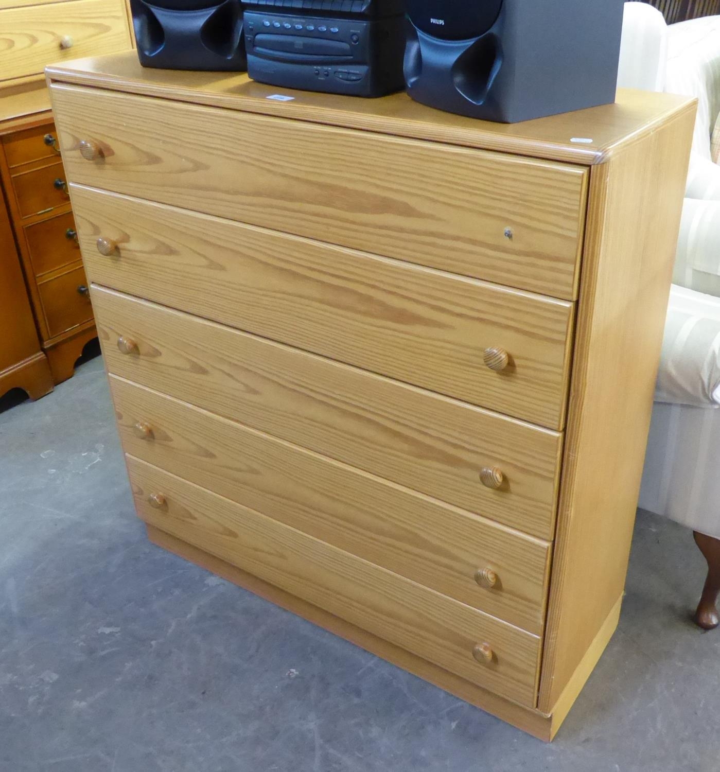 A PINE CHEST OF FIVE LONG DRAWERS, TWO PINE BEDSIDE CABINETS AND A WHITE OPEN BOOKCASE (4)