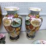 A PAIR OF CONTINENTAL PORCELAIN LARGE OVULAR VASES, PAINTED WITH LEAVES, 16 ½” HIGH