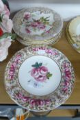 A SET OF TWELVE COALPORT CHINA 'CELEBRATION OF COALPORT ROSES’ LIMITED EDITION CABINET PLATES