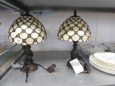 PAIR OF TIFFANY STYLE BEDSIDE LAMPS, CREAM SHADE WITH AMBER/PALE YELLOW INSET PEBBLES  (BASE TO