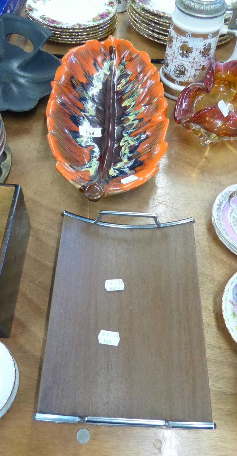 1960’S CURVED TEAK TRAY WITH CHROMIUM PLATE RAISED END HANDLES AND SCROLL FEET, 10 ¼” LONG AND A