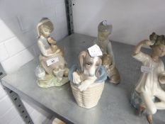 THREE LLADRO SPANISH PORCELAIN FIGURE GROUPS, VIZ A GIRL SEATED WITH DOG ON HER LAP AND A LANTERN; A
