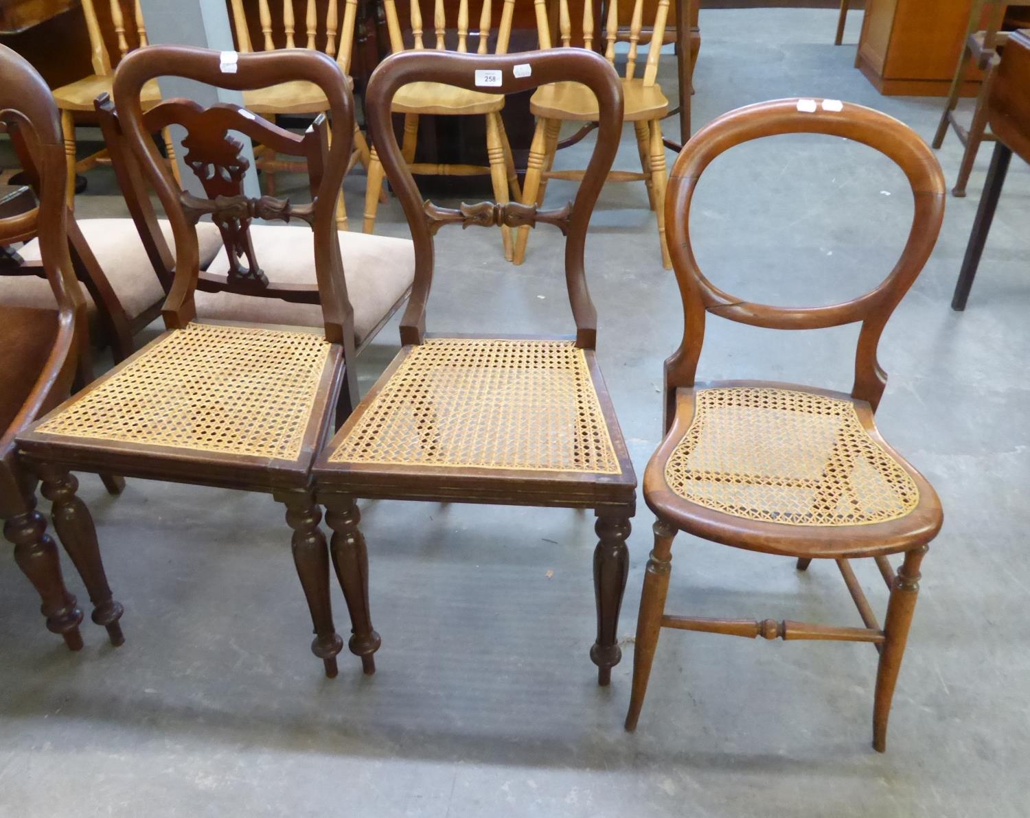 A PAIR OF EARLY VICTORIAN MAHOGANY SPOON-BACK CANE SEATED CHAIRS AND AN EDWARDIAN LOW SEATED DRAWING