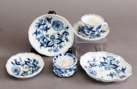 19TH CENTURY MEISSEN UNDERGLAZE BLUE TEACUP AND SAUCERS, two small dishes, and a similar patter