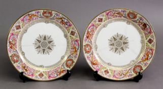 A PAIR OF MID-19TH CENTURY SEVRES CABINET PLATES, the hand painted polychrome sauce rim decorated